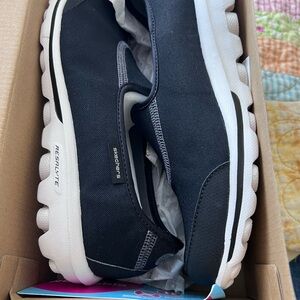 Skechers Black and White Women's Slip-On Sneakers